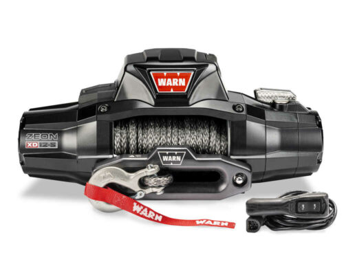 Black Warn winch with rope, hook, and remote control, featuring prominent red Warn logo on top.